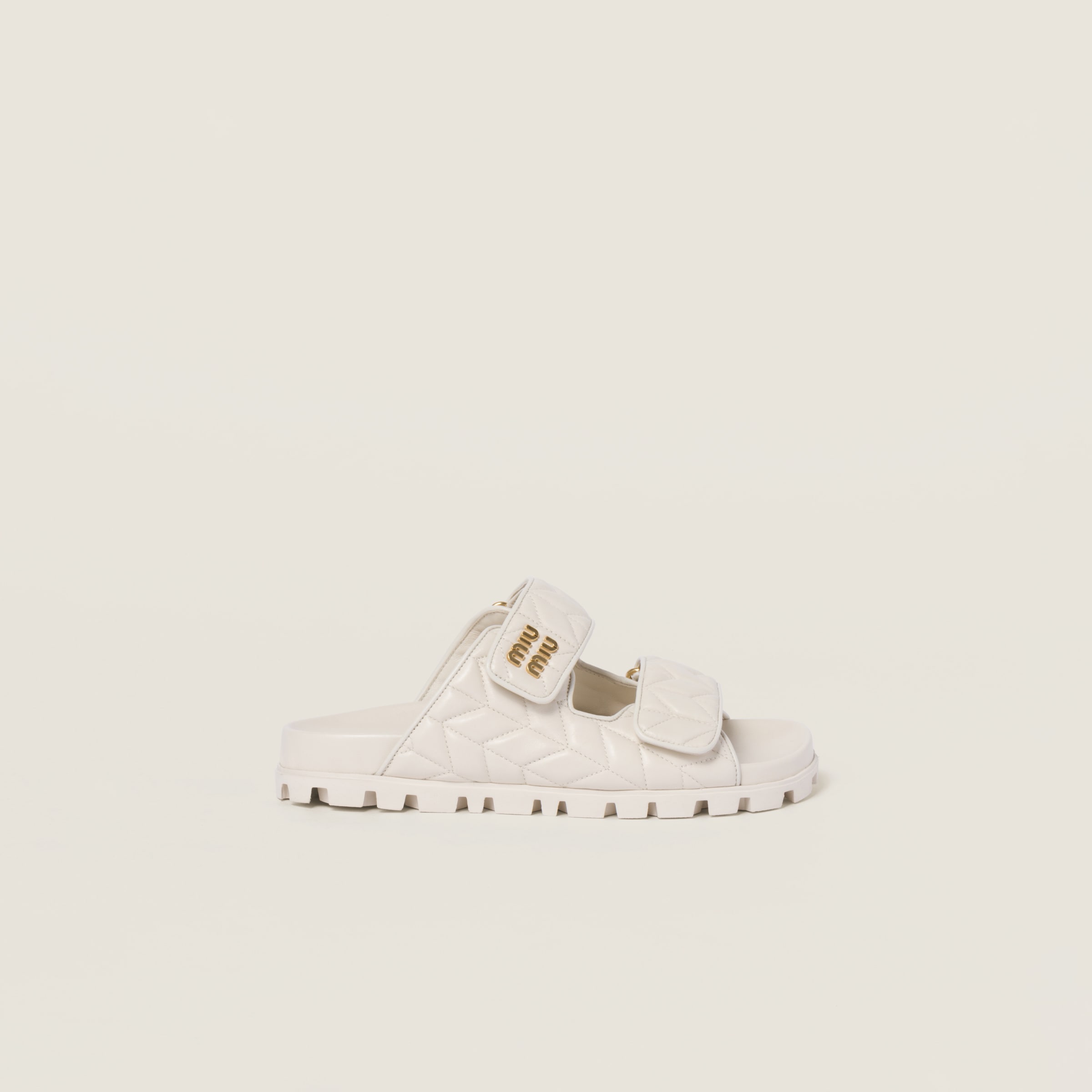 Shop Miumiu Matelassé Nappa Leather Slides In White