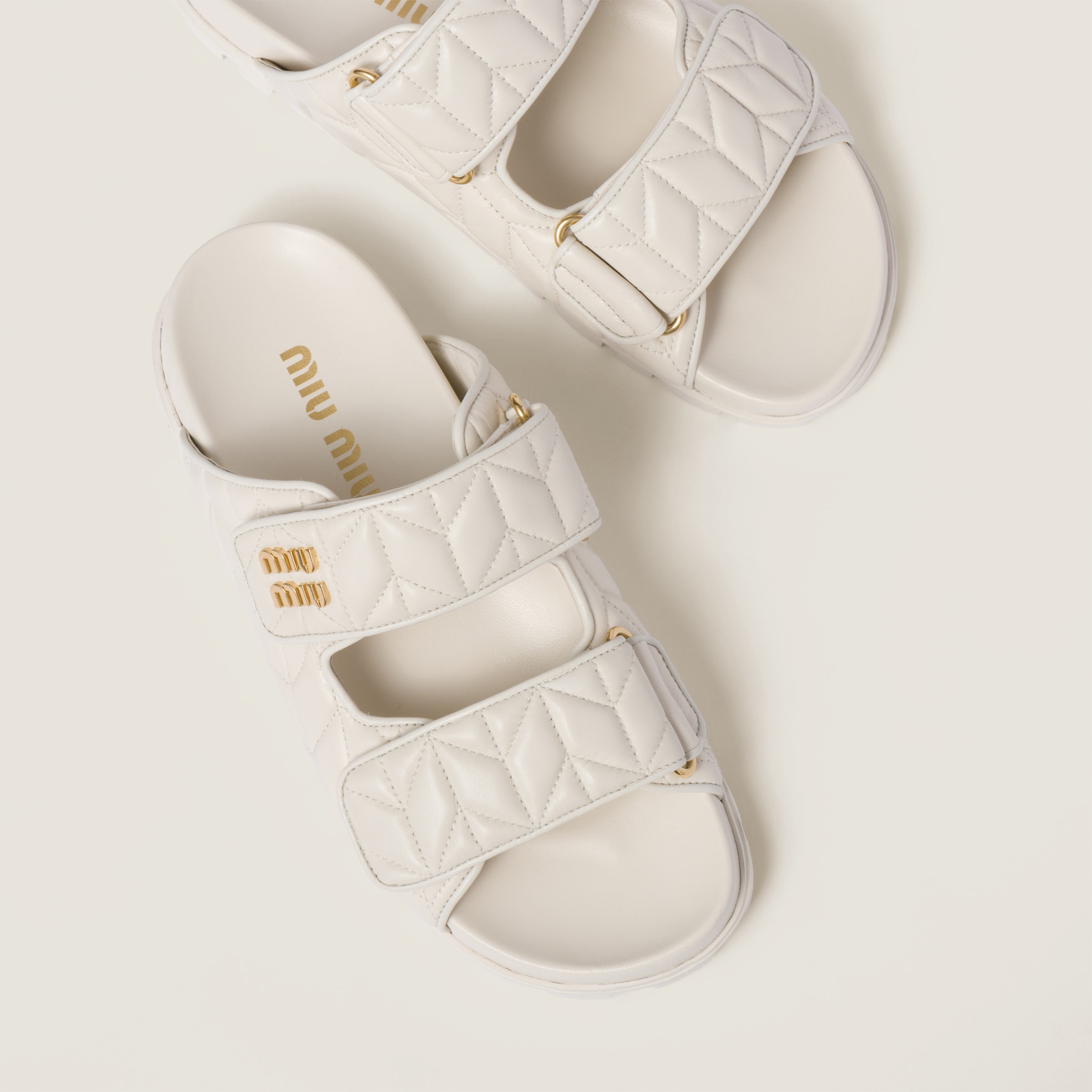 Shop Miumiu Matelassé Nappa Leather Slides In White