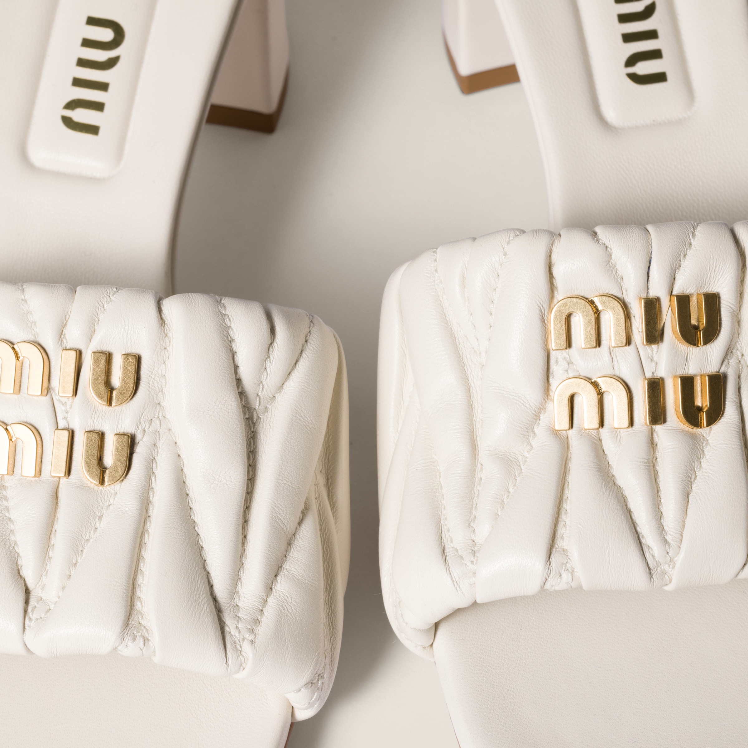 MIU MIU MATELASSÉ NAPPA LEATHER SLIDES