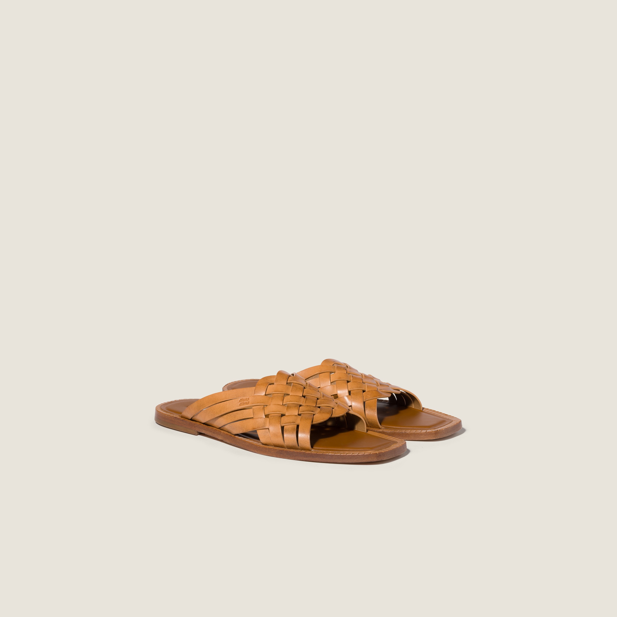 Leather slides from Miu Miu - $1,220