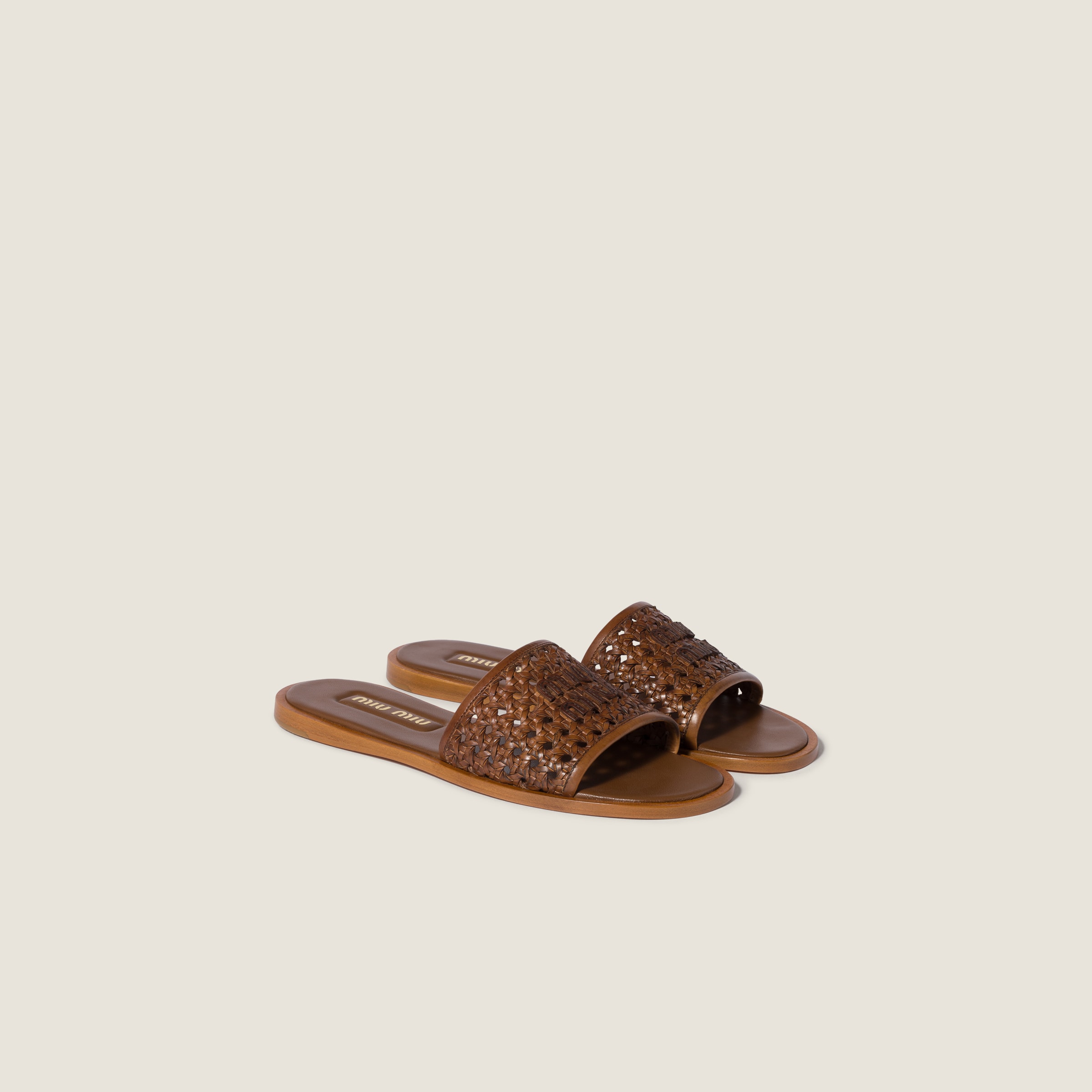 Woven leather slides from Miu Miu - $1,390