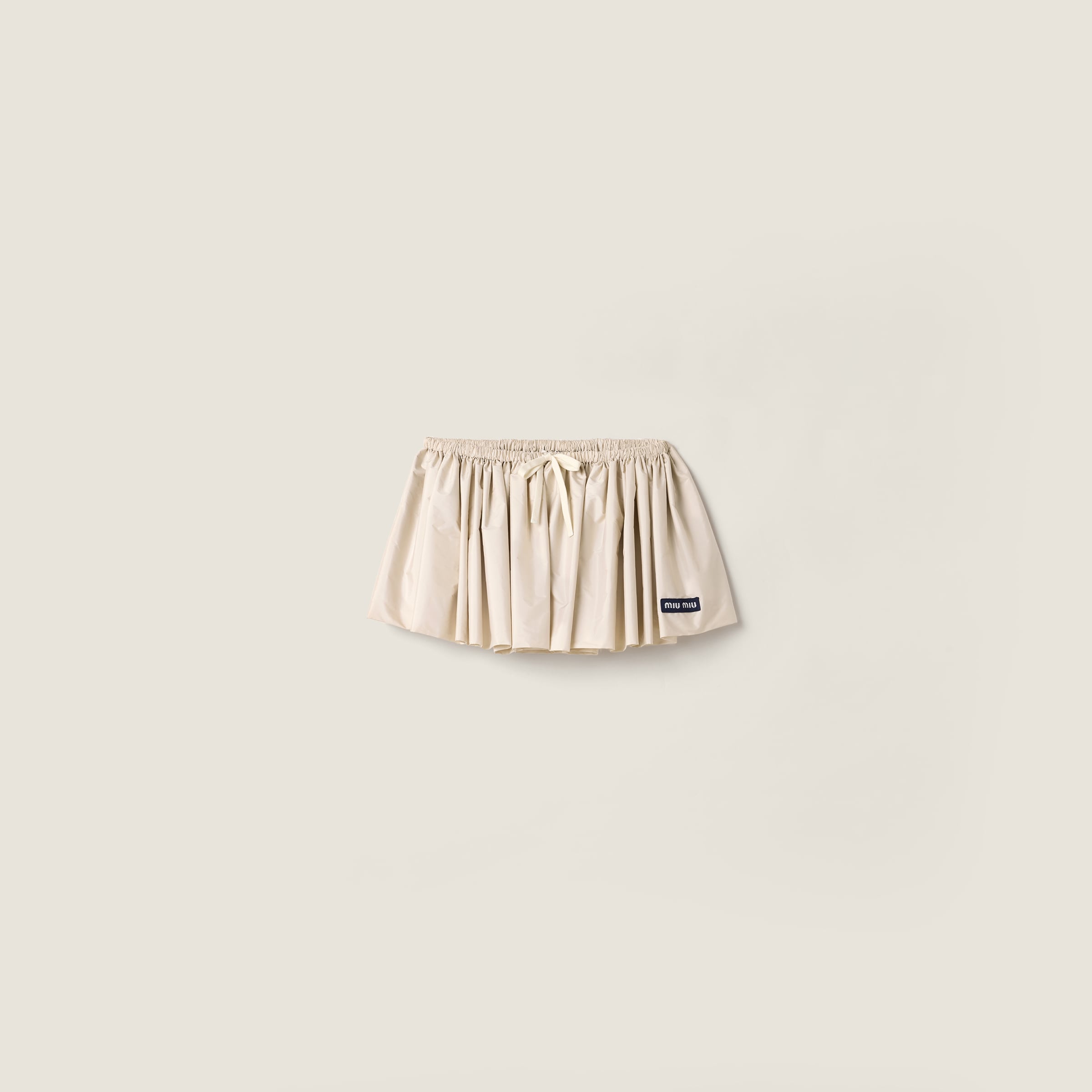 Technical pongé miniskirt from Miu Miu - $1,750
