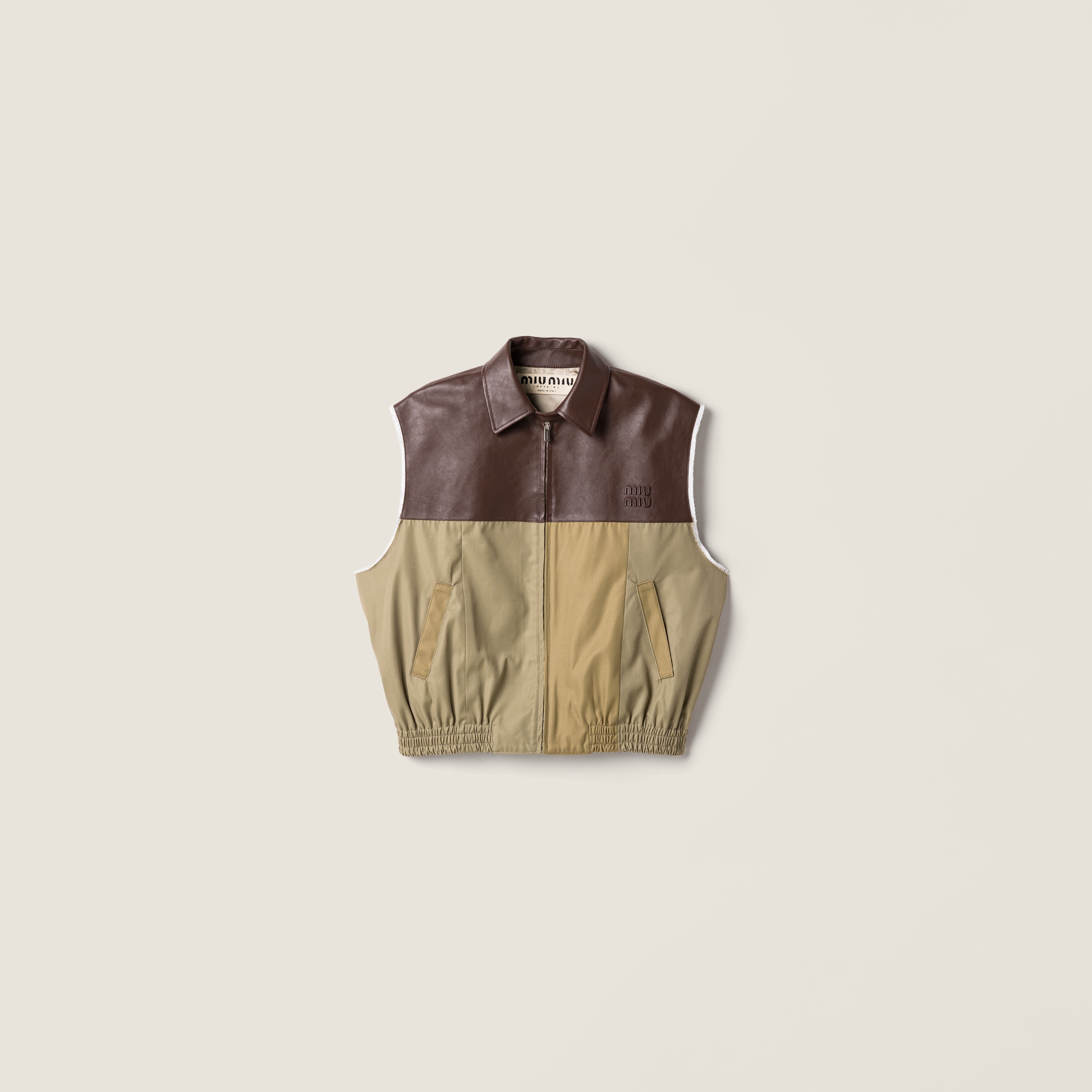 Chino and leather vest from Miu Miu - $6,200